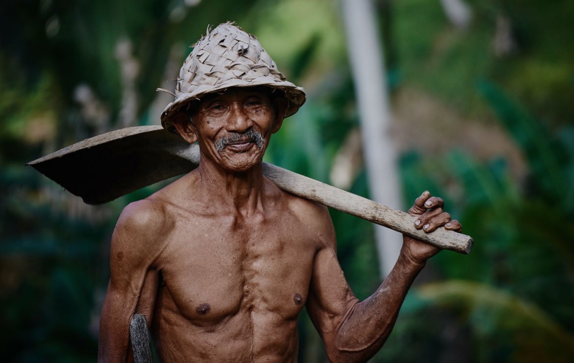 Man with Shovel over Shoulder